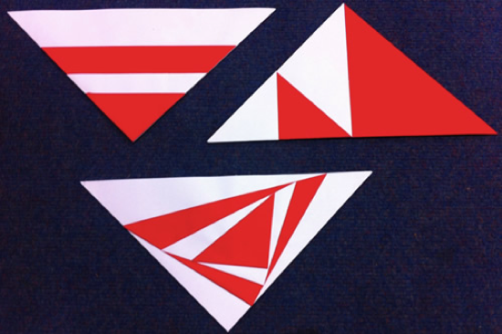 Røde og hvite trekanter på svart bakgrunn